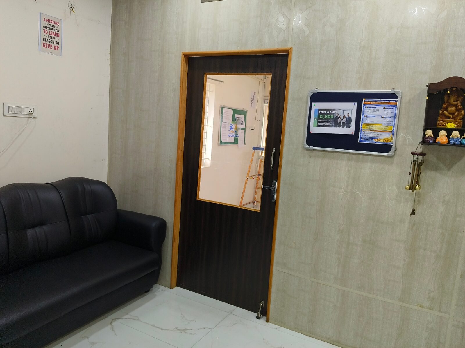 Customer waiting area with sofa